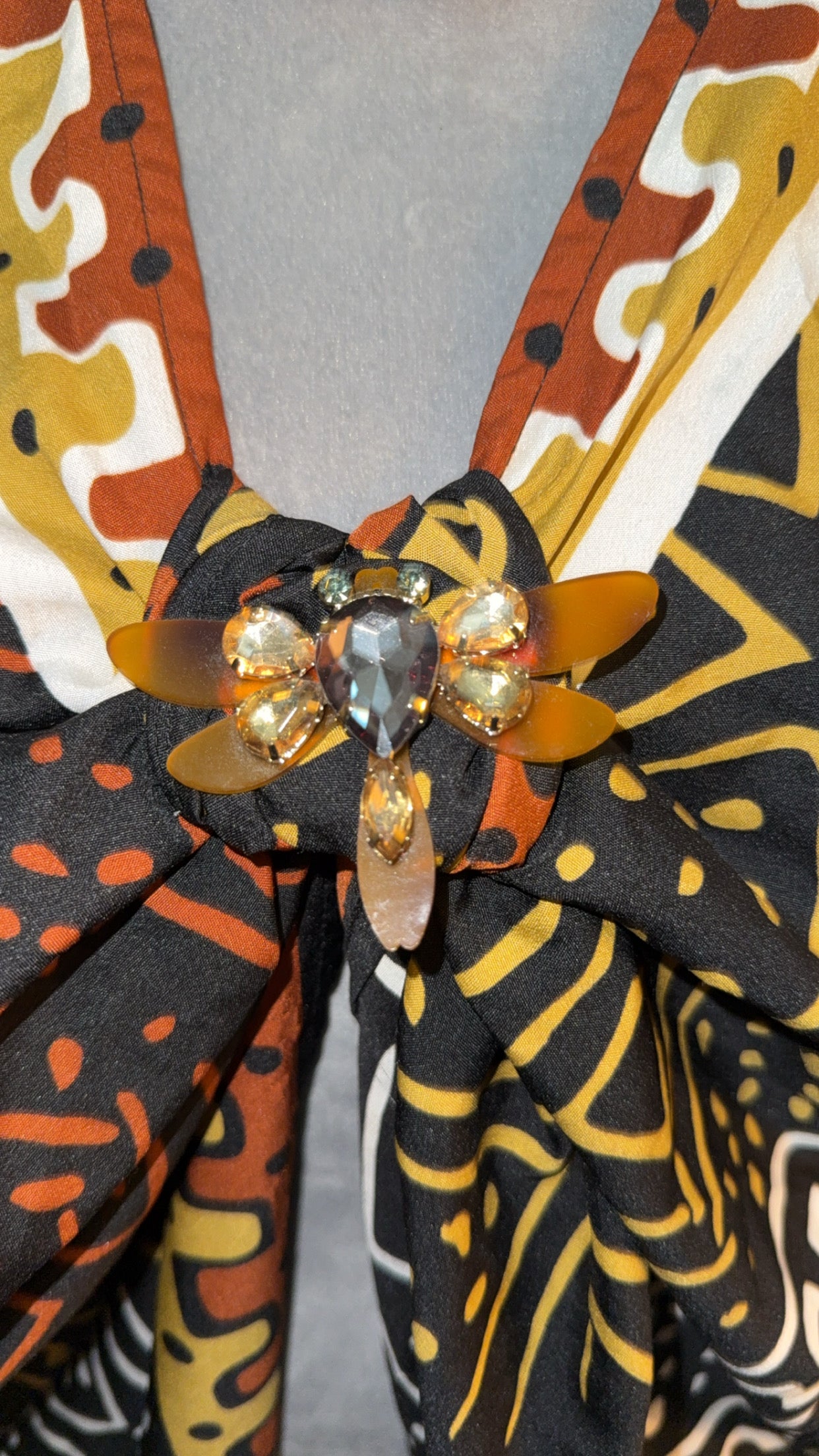 Oversized multi color shirt with brooch