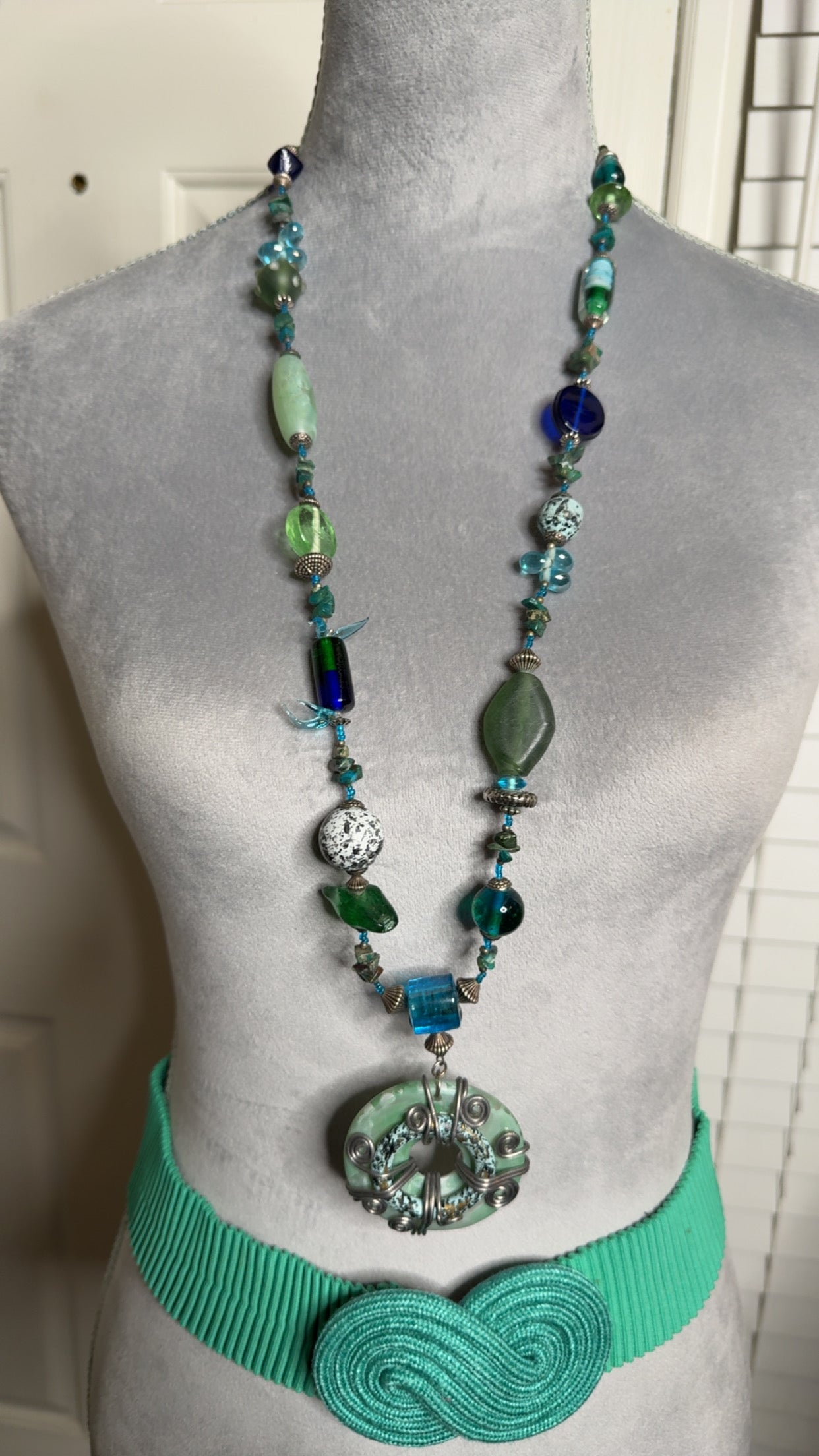 Long necklace with charm