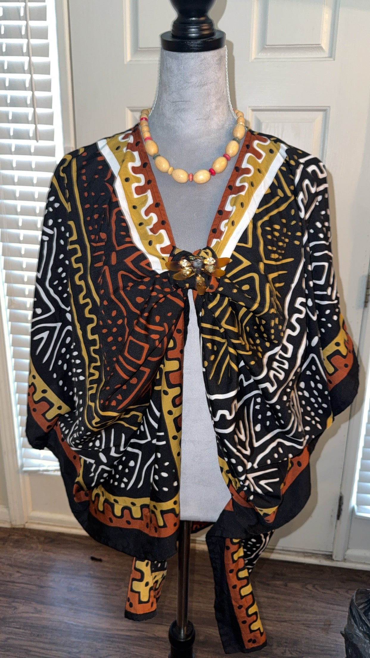 Oversized multi color shirt with brooch